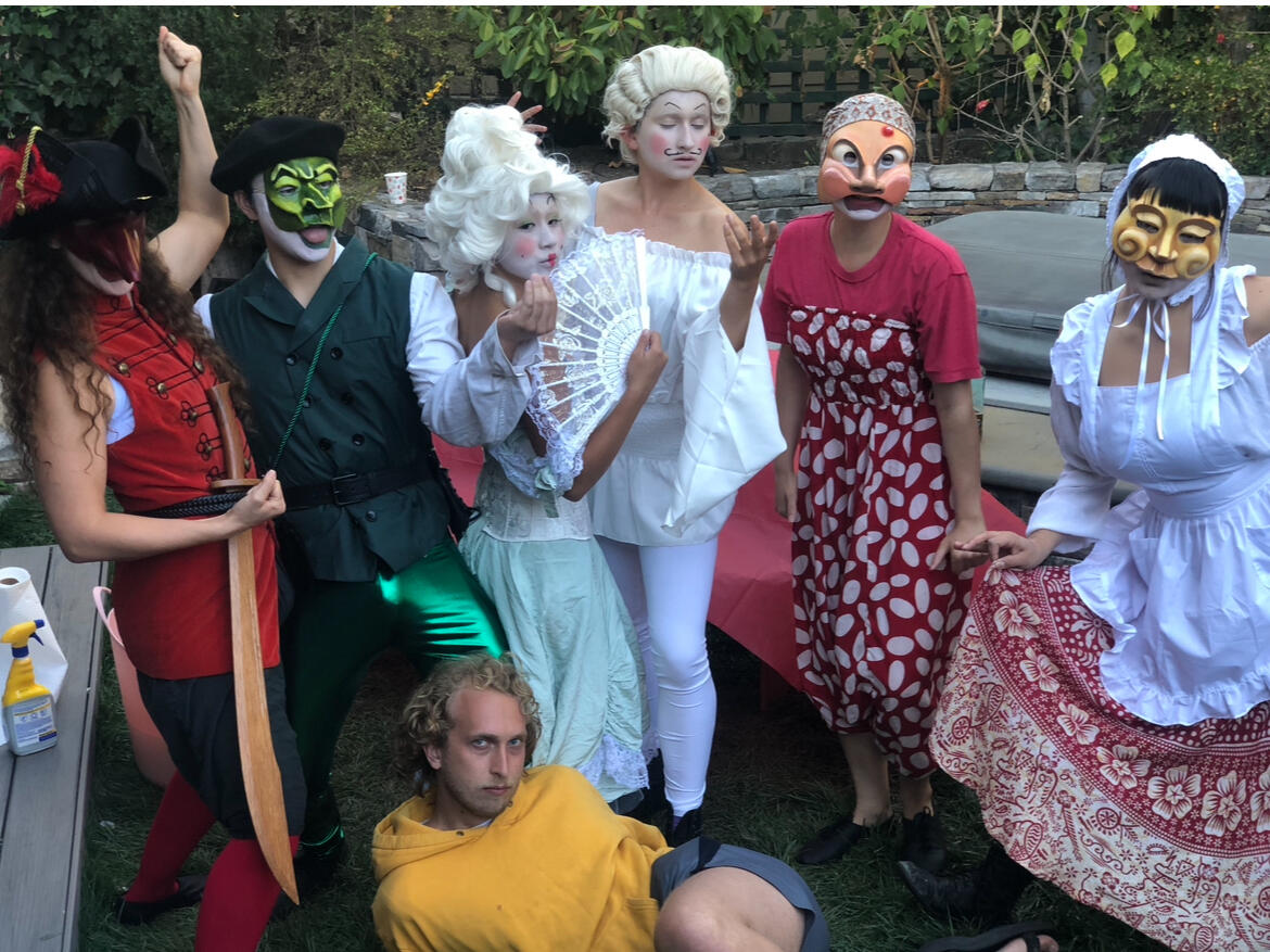 Sarnow poses with actors on set