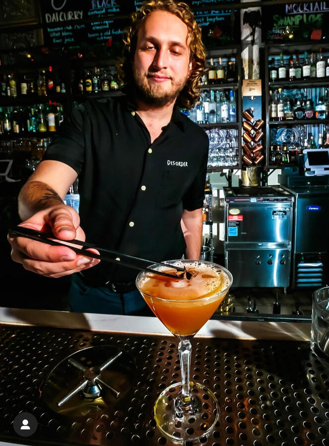 Montelobos mezcal, Drambuie, Saint Elizabeth Allspice Dram, Sweet Vermouth, orange juice, Lindsey Crude Habanero Magnolia bitters, star anise