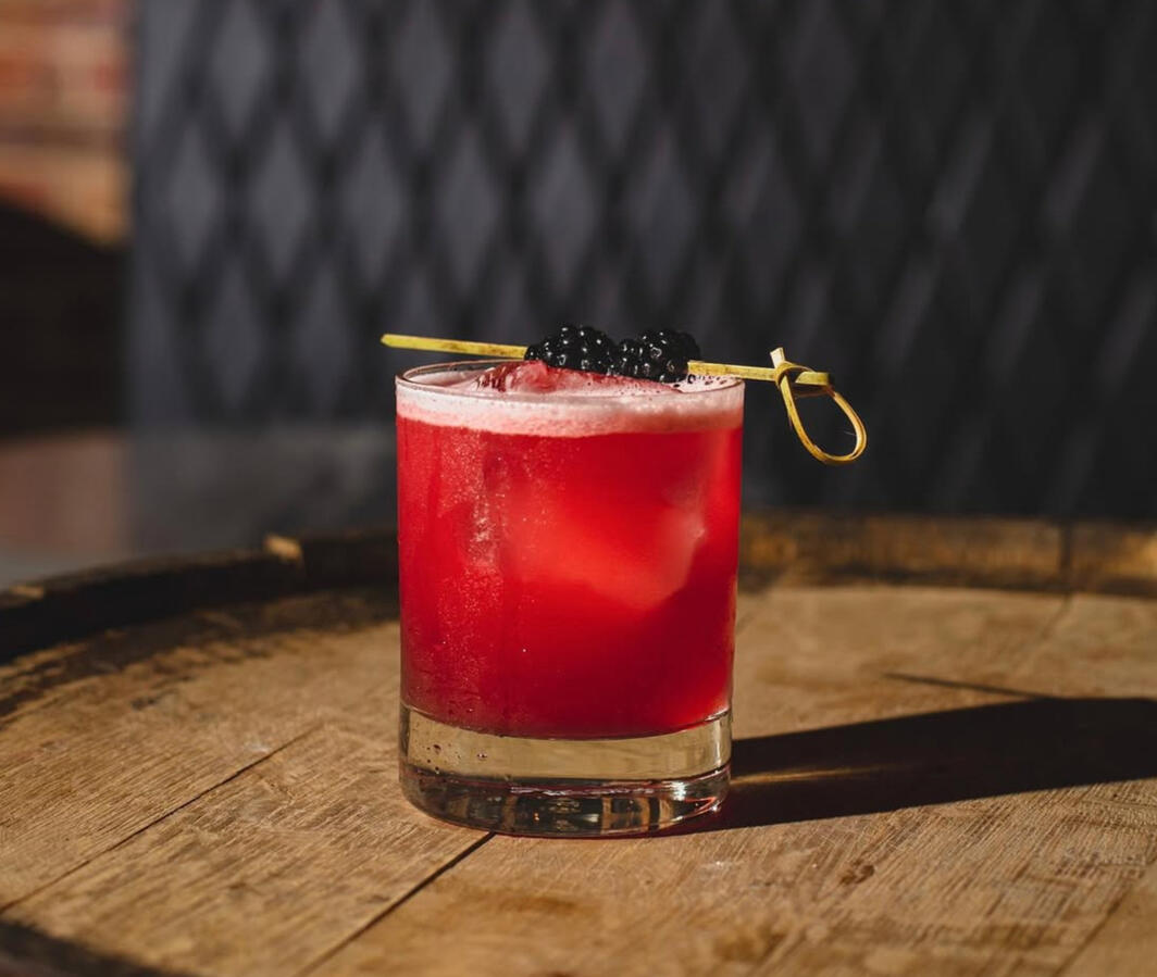 Hornitos Black Barrel Tequila, Green Chartreuse, Velvet Falernum, blackberry syrup, lime juice, King Floyd's scorched pear and ginger bitters, blackberry garnish - BEST SELLER
