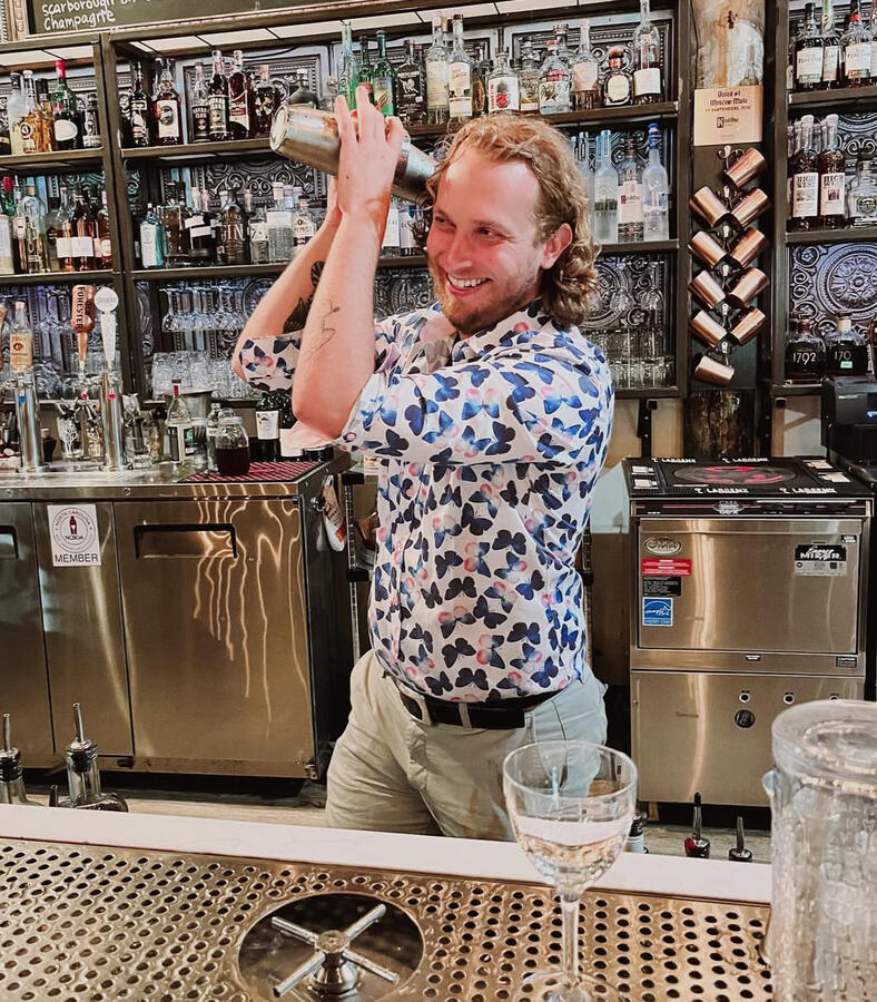 Smiling while bartending